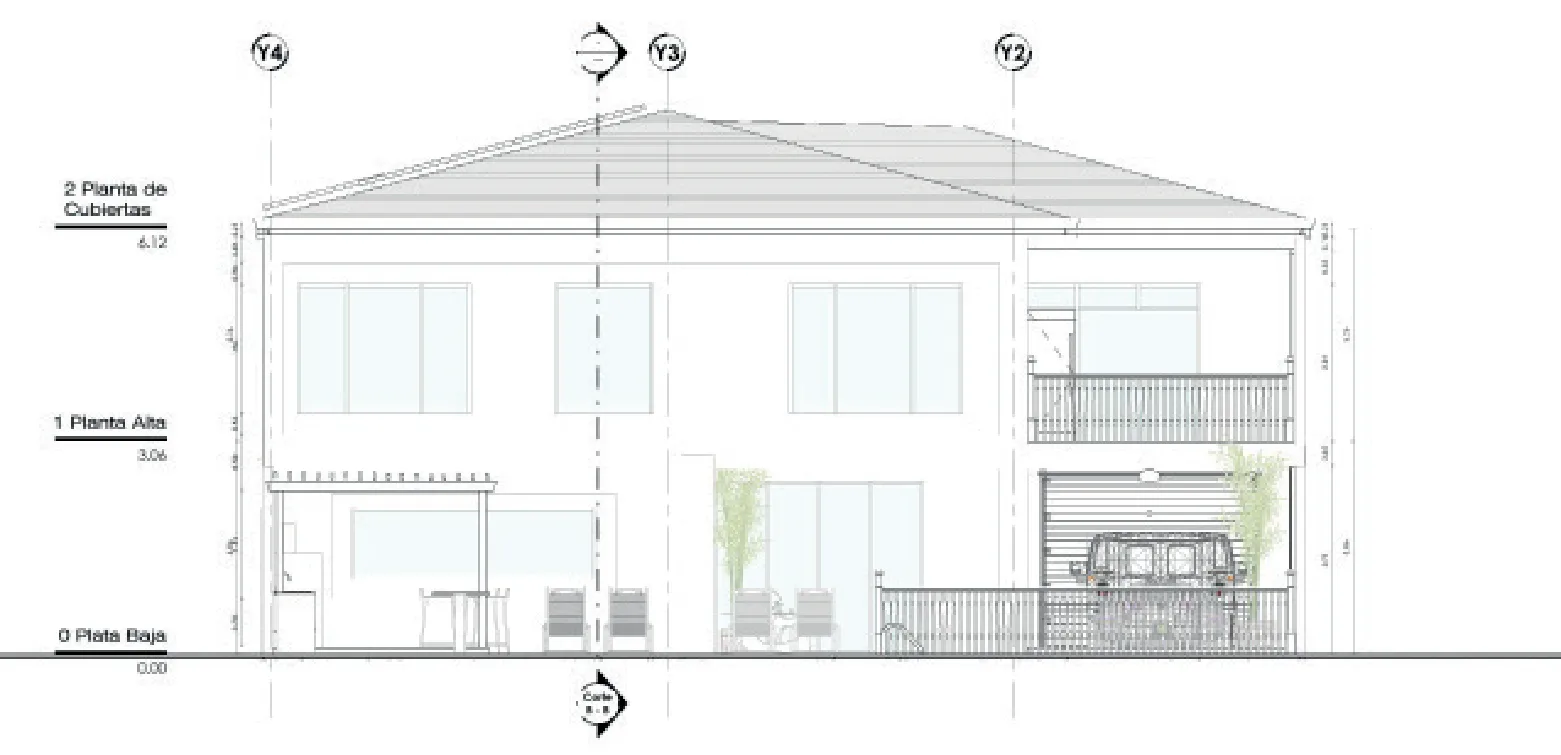 Elevación posterior con terraza, barbacoa y garaje