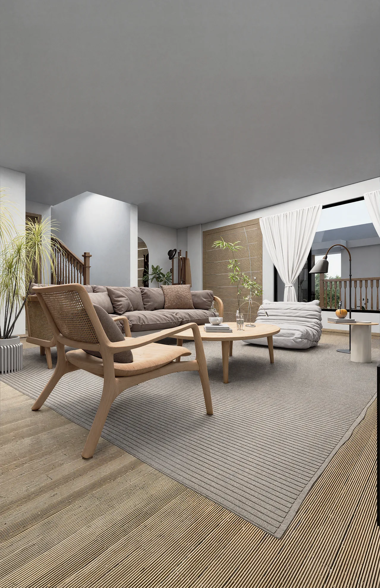 Sala con sofá y butaca de madera junto a la escalera
